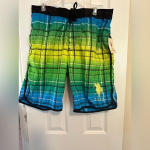 US Polo men’s swim trunks size large. Green, yellow, blue with polo logo on leg.